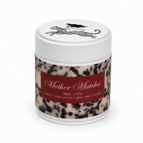 30g tin of mother matcha with a white lid, cream and black tortoise shell wrap, red label